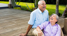 Latin senior couple laughing together